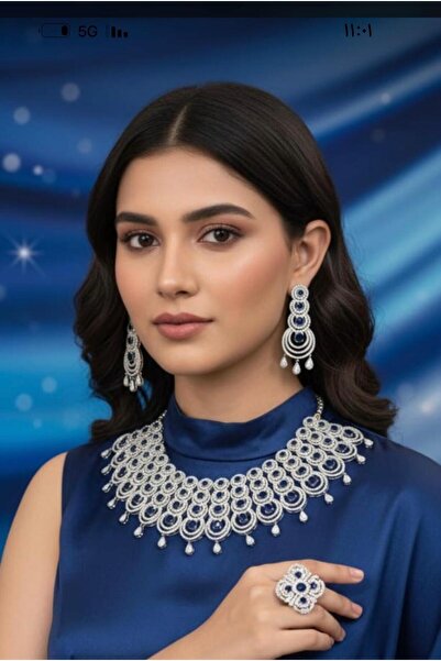 SS A silver zircon set with navy blue stones. The set consists of a necklace, earrings, and a ring.