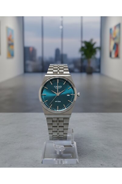 cs Classic steel round watch with a green dial