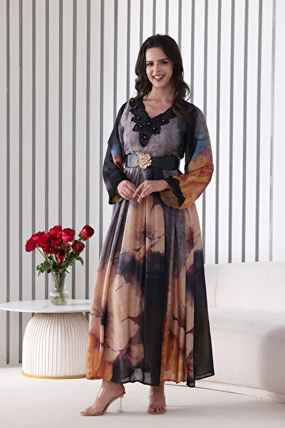 Verona Trading Company Silk maxi dress with a large pink print and artistic touches, featuring a decorative collar and embellished belt.