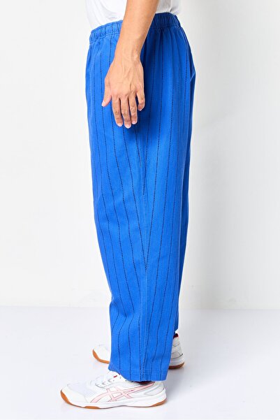 Puma Men Sportswear Fit Stripe Outdoor Track Pants, Multicolor