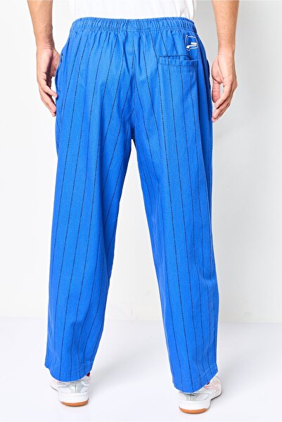 Puma Men Sportswear Fit Stripe Outdoor Track Pants, Multicolor