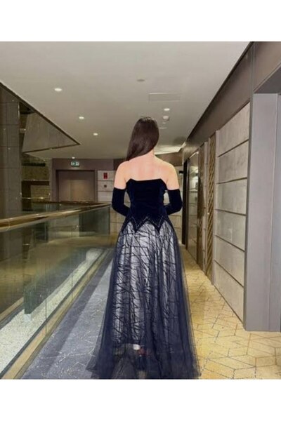 Thara A navy blue dress with sleeves, suitable for elegant evening wear.