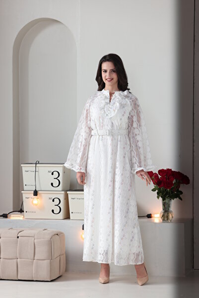 Verona Trading Company Luxurious white lace maxi dress with wide, embellished sleeves and a front ruffle, complete with a matching belt.