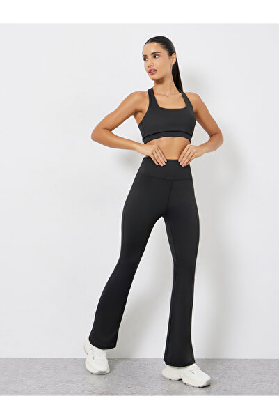 Styli Pack of 3 - Multi Cross Back Padded Sports Bra, Paneled Top and Flared Leggings