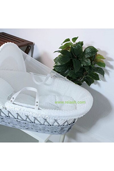 Reiashn Grey Moses basket bed with white bedspread