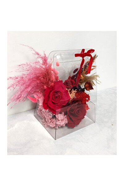 OEM Arrangement with dried and cryogenated flowers in a plexiglass purse