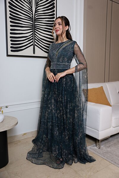 molan fashion A long evening dress in a dark green color with a hint of blue, with embroidery and a sheen that suggests you are wearing a piece of heaven.