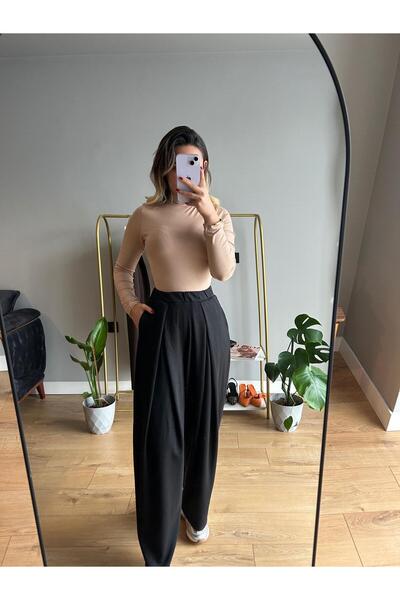 BUSEM Önü pileli ve yumuşak dokunuşlu modal kumaşlı geniş paça pantolon