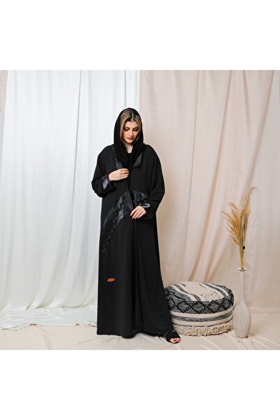 Leatherthreads A luxurious black abaya made of soft silk with delicate embroidery along the edge.