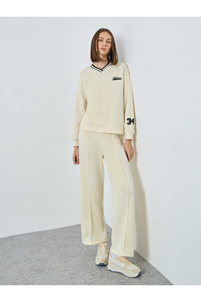 Styli Women Off White Varsity Sweatshirt