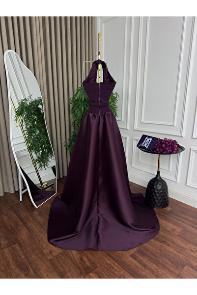 Generic Luxurious evening gown with a chiffon bodice, a Mikado flared skirt with a long train, and an elegant halter neck design in purple.