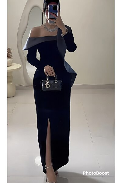 Riva A long and attractive black evening dress.