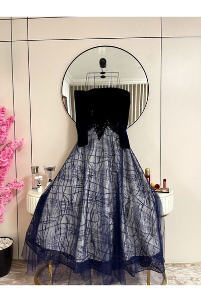 Thara A navy blue dress with sleeves, suitable for elegant evening wear.