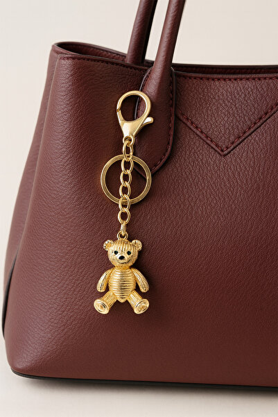 Modex Breloc pentru geantă cu ursuleț cu detaliu linie galbenă aurie