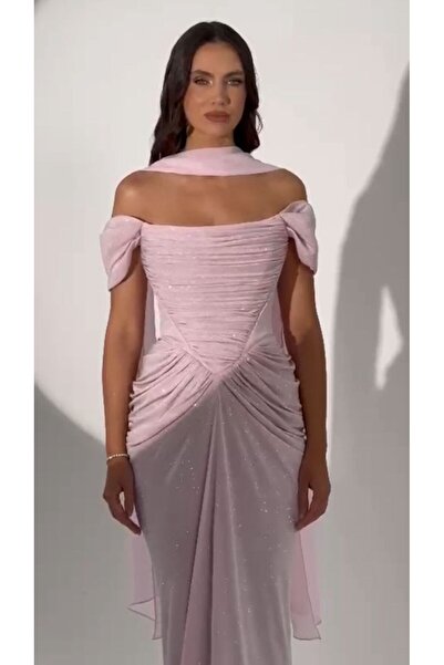 ALFABETA A shimmering evening gown with off-the-shoulder sleeves and an elegant draped silhouette, paired with a shawl.