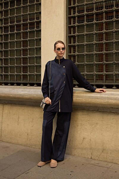 Hilay طقم بنطلون إدورا من جلد الغزال بقطع قماش مخيطة معاً باللون الأزرق الداكن