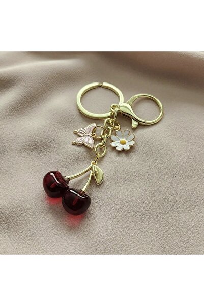 VEYA A stylish keychain with a cherry, butterfly, and flower design – an attractive bag accessory and a cute everyday touch.