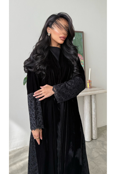 outline A black quarter-circle abaya with a blend of velvet and lace fabric.