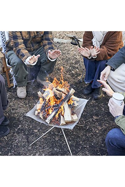 denix A foldable stainless steel mesh fire pit with a carrying bag, suitable for lighting fires in the garden, picnics, and barbecues.