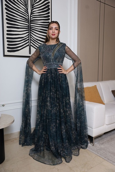 molan fashion A long evening dress in a dark green color with a hint of blue, with embroidery and a sheen that suggests you are wearing a piece of heaven.