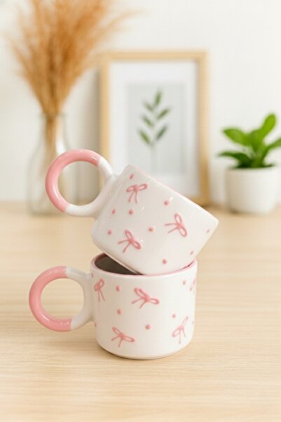 SırART كوب سيراميك مزخرف يدويًا بنمط فيونكة وردية مع مقبض على شكل عقدة، مكون من قطعتين