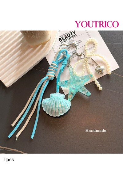 Youtrico سلسلة مفاتيح مصنوعة يدويًا على شكل قوس نجم البحر على شكل صدفة بحرية ...