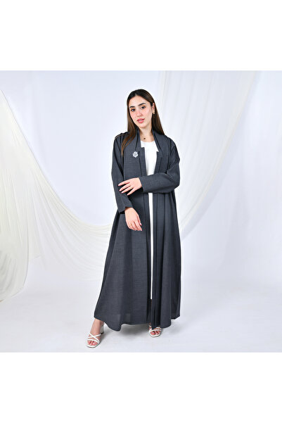 HAWRAA ABAYA A gray abaya with a simple, formal design and a quarter-circle cut, adorned with flower-shaped buttons that add a feminine touch.