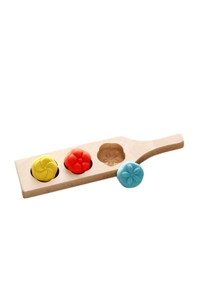 Generic Wooden cookie sheet with three flower shapes, made of wood, a kitchen baking tool.