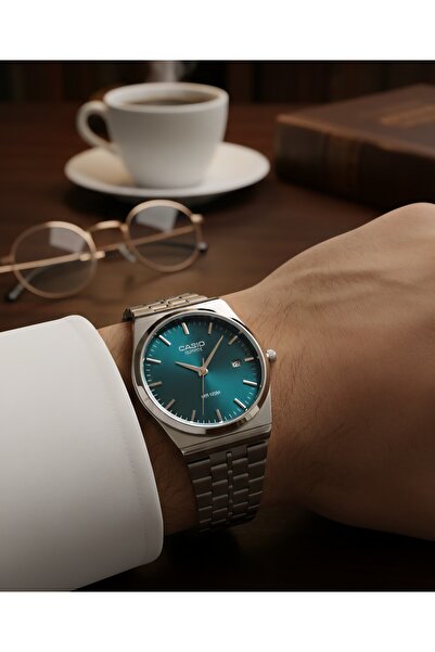 cs Classic steel round watch with a green dial