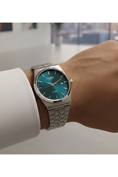 cs Classic steel round watch with a green dial