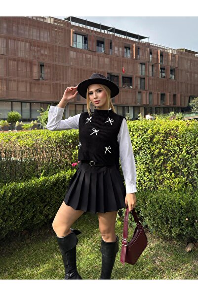 Angel Mia سترة تريكو بتفاصيل فيونكة باللون الأسود