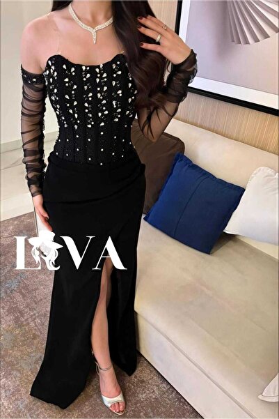 Liva Black embroidered evening dress with sheer sleeves and a front Slit .