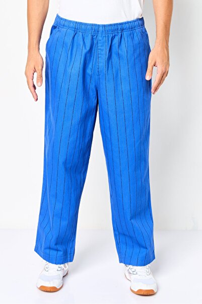 Puma Men Sportswear Fit Stripe Outdoor Track Pants, Multicolor