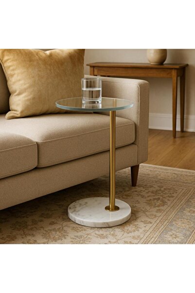 Vi Markets A modern glass-top side table with a sleek gold stand and white base.