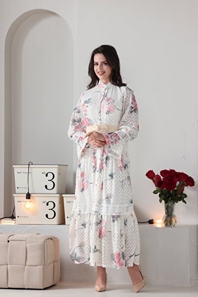 Verona Trading Company Verona maxi dress with puff sleeves, floral print, and tulle fabric lined with a geometric pattern.