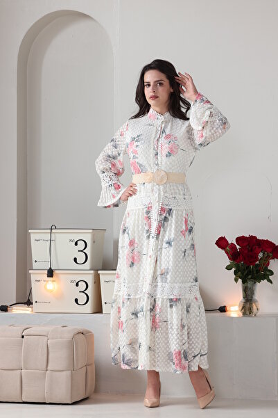 Verona Trading Company Verona maxi dress with puff sleeves, floral print, and tulle fabric lined with a geometric pattern.