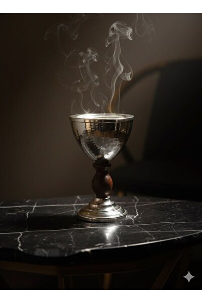 MDK A luxurious silver incense burner with an elegant wooden base. A classic design for incense burning with a distinctive modern touch.