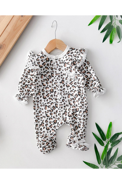 hümabebe Transitional Jumpsuit with a Fishtail Bow, Ruffle Details on the Shoulders, and Snap Fasteners on the Legs.