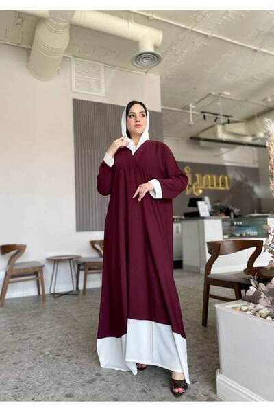 Leatherthreads A luxurious two-tone abaya with delicate embroidery on the edge.