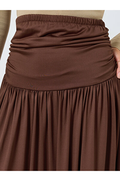 Styli Brown Solid A-Line Pleated Knit Maxi Skirt