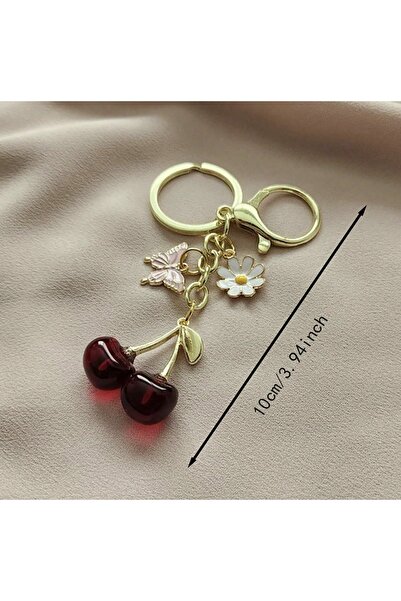 VEYA A stylish keychain with a cherry, butterfly, and flower design – an attractive bag accessory and a cute everyday touch.