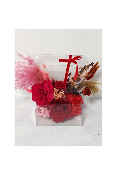 OEM Arrangement with dried and cryogenated flowers in a plexiglass purse