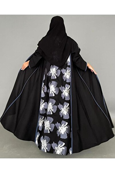 OLGA-ABAYA A stylish and modern abaya from Olga, made of linen fabric with embroidery and lace trim, featuring a quarter-circle silhouette and including a headscarf.
