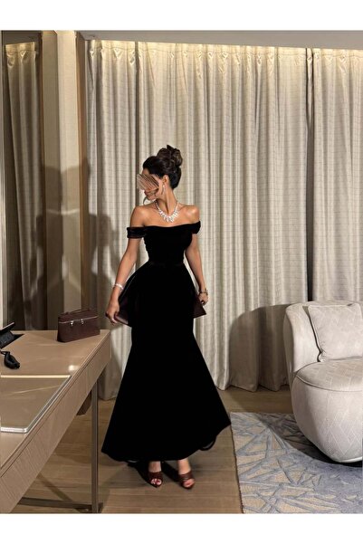 Generic Dark brown velvet evening dress with a wide shoulder cutout and a fishtail (peplum) design.