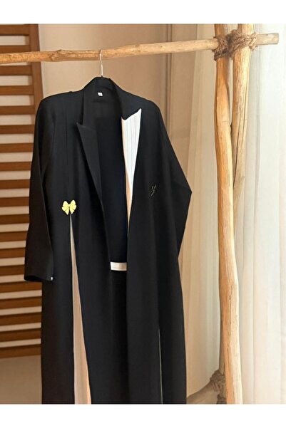 outline Black abaya with white accents