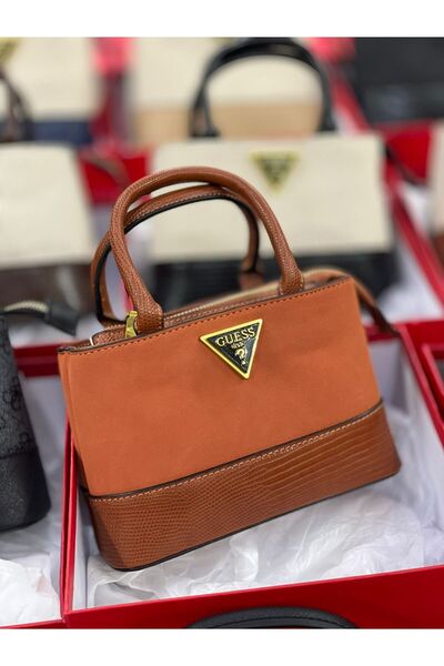 Generic A small handbag in a burnt orange color, perfect for adding a warm touch of color to your everyday accessory collection.