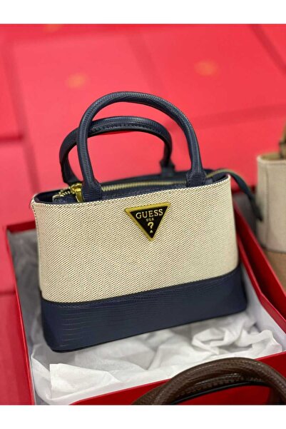Generic A beige mini canvas bag with a dark navy base. A modern and stylish design that will turn heads in all your daytime looks.