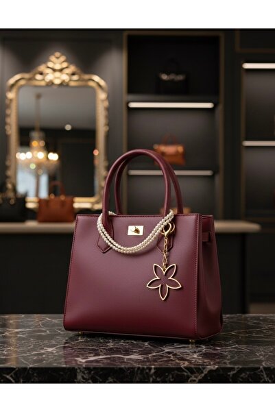 abanitesettür زينة حقيبة باباتيا تشارم ذهبية اللون