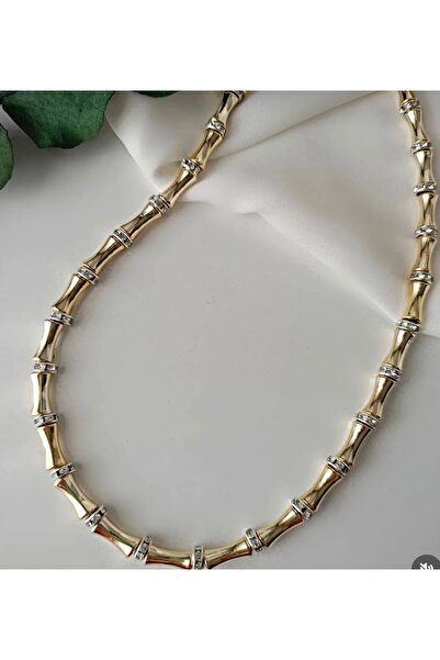 BULUT SEPETİ قلادة على شكل عظمة مفصلية من دوريكا باللون الذهبي