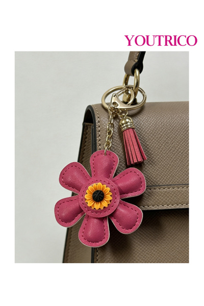 Youtrico قطعة واحدة من حقيبة جلدية مصنوعة يدويًا على شكل عباد الشمس وسلسلة مفاتيح على شكل كرتون لطيف